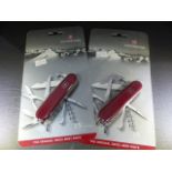 Two Victorinox 15 function original Swiss Army Knife in red. Unopened in casing.