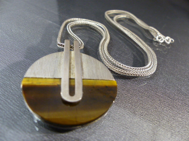 Spanish contemporary pendant and chain. The approx 33.5mm diater disc is half Tigers eye and Half