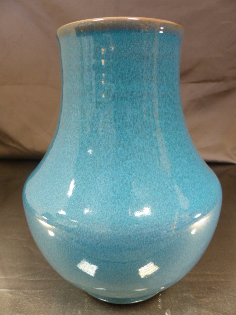 Poole Pottery 1930's red bodied squat vase with bulbous middle decorated with a deep 'Chinese'