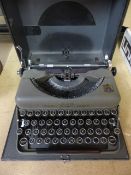 Aldis boxed vintage projector along with a Vintage typewriter in case