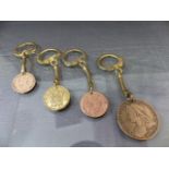 Coins - Four various coins mounted on key-rings - 1937 George VI Three-pence, 1900 Victoria Penny,