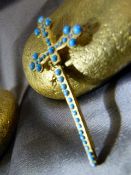 Gold coloured tie clip in the form of a Cross inset with Turquoise cabachons marked Depose to back