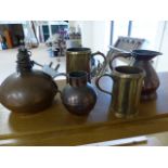 Collection of brassware to include two tankards, two jugs and a lamp base