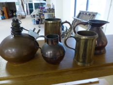 Collection of brassware to include two tankards, two jugs and a lamp base