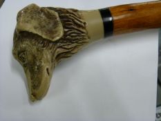 Malacca walking cane with carved dogs head grip. A/F