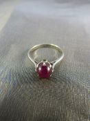 9ct White gold and star ruby ring. Star Ruby set in high claw setting. Weight approx 2.7g UK