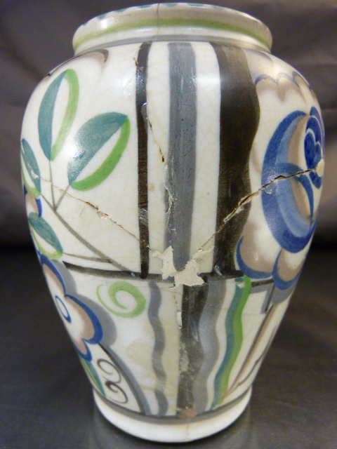 A 1930`s Poole Pottery Vase decorated in the YO pattern with coloured stylised flower heads and - Image 8 of 10