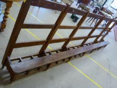 Large stained pine school bench / rack