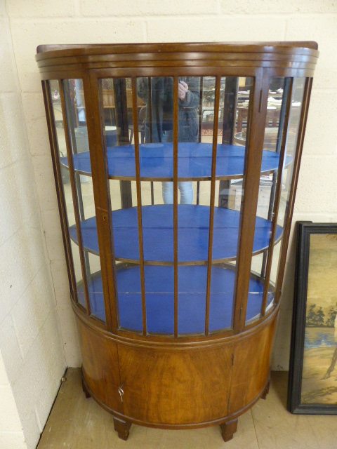 Mahogany bow fronted display cabinet with cupboard underneath. Key in office