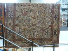 Large Arabic red ground hand woven rug with all over pattern.