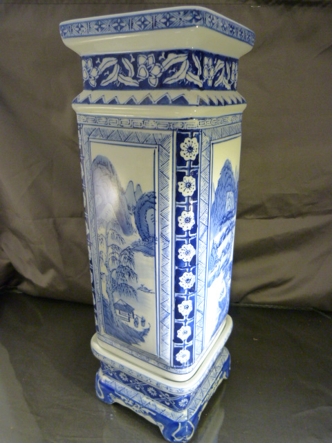 Modern Blue and white oriental transfer vase of rectangular form on a matching plinth. Blue