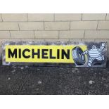 A Michelin rectangular enamel sign with Mr. Bibendum pictorial image to one side, 77 1/4 x 18 1/4".