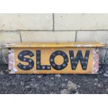 A rare and early wooden pediment road sign 'Slow', double sided with glass bead reflectors to both