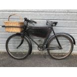 An early shop delivery bicycle bearing a plaque for Kent and Sons, Agents, Wantage, an unrestored