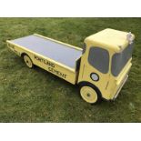 A 'Portland Blue Circle Cement' wooden lorry display model surmounted by a miniature Mr. Bibendum on