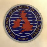 A National Association of Cycle Trailers circular glass sign, 9" diameter.