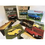 A selection of sales brochures relating to Renault and Peugeot.