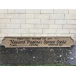 A rare wooden double sided sign advertising Howard Hughes's Spruce Goose maiden flight November