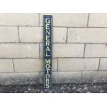 A General Motors narrow tin advertising sign, 3 1/4 x 29".