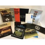 A collection of sales brochures relating to BMW, Mercedes, VW and Audi.