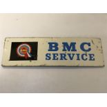 A small 'BMC Service' tin advertising sign, 14 3/4 x 4 1/2".