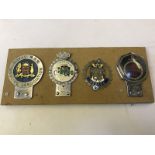 Four car badges including Silverstone by J.R. Gaunt of London and Royal NSW Bowling Association.