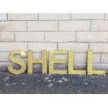 A group of five enamel letters that spell the word Shell, height approx. 14 1/2" tall.