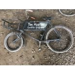 A butcher's bicycle with inset advertising panel.