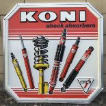 A Koni Shock Absorbers aluminium and embossed plastic advertising sign, 28 x 29".