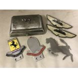 Two David Brown Aston Martin part enamel bonnet badges, a chrome plated prancing horse bonnet