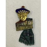 A Douglas part enamel lapel badge in the form of a Scotsman, made by H.W. Miller. Provenance as