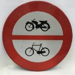 A circular street sign depicting a motorcycle and a bicycle within a red circle, 23 3/4" diameter.