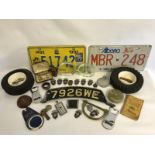 A collection of assorted motoring collectables to include tyre ashtrays etc.