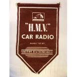 An 'HMV Car Radio Dealership' hanging pennant.