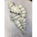 A Michelin plastic figure of Mr. Bibendum, dated 1966 to sit on an air pump.