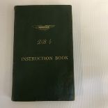 An Aston Martin DB4 instruction book with supplement inside and pen annotation to the inside front