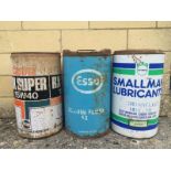 Three five gallon oil drums including Smallman Lubricants and Esso.