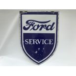 A Ford Service shield shaped double sided enamel sign with original bracket, 23 3/4 x 33 1/2".