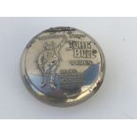 A John Bull Tyres circular tobacco case, the lid embossed with a standing figure of John Bull.