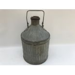 A five gallon oil drum in corregated, galvanised steel, embossed: Regent Oil Company Limited.