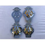 Four AA badges, three with country of origin pediments including New Zealand and Malaya.