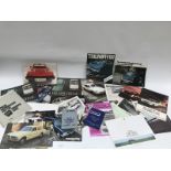 A quantity of Triumph brochures.