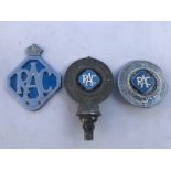 Two Royal Automobile Club Associate car badges with powder blue enamel centres and one other.