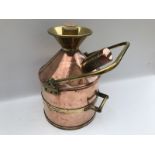 A 20 litre petrol measure in copper and brass, by Wragg Brothers Limited of Wickford, engraved
