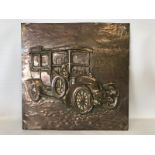 A copper embossed plaque depicting an Edwardian motor car, probably a Renault, 11 x 11".