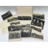 A small collection of early black and white photographs including a South Devon garage scene, a