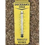 A Duckham's Oils 'Perfectly Refined' rectangular enamel thermometer, with partial broken tube, 13