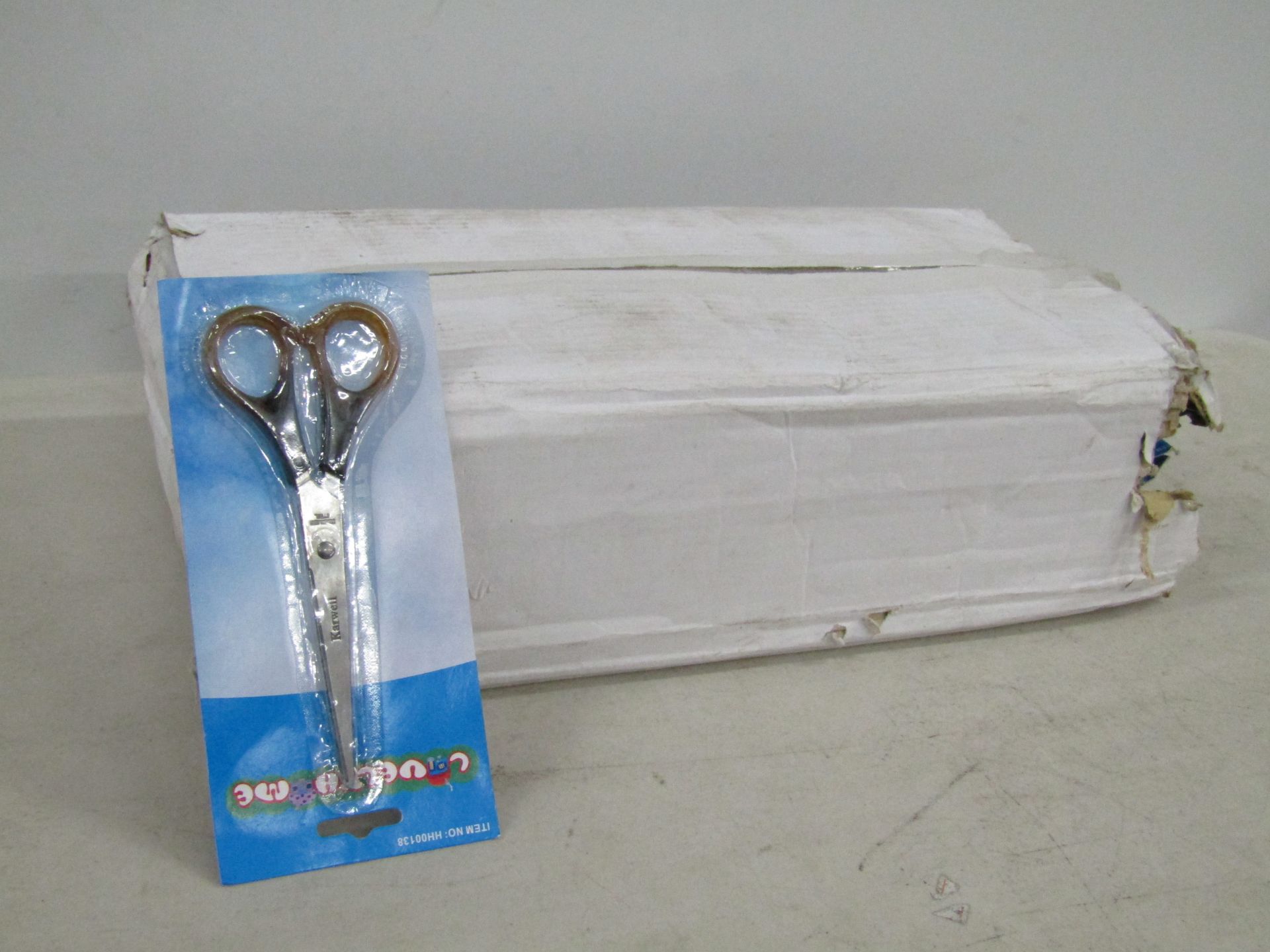 Box containing aprox 100 pair of kitchen scissors.