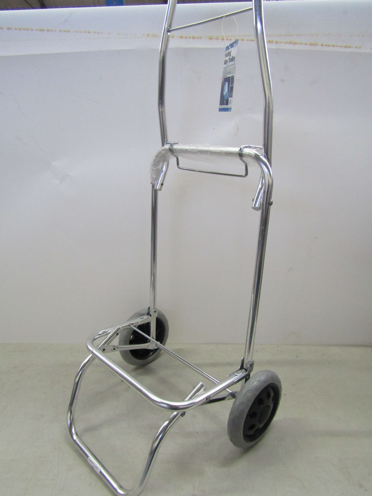 Folding alloy shopping trolley, unused.