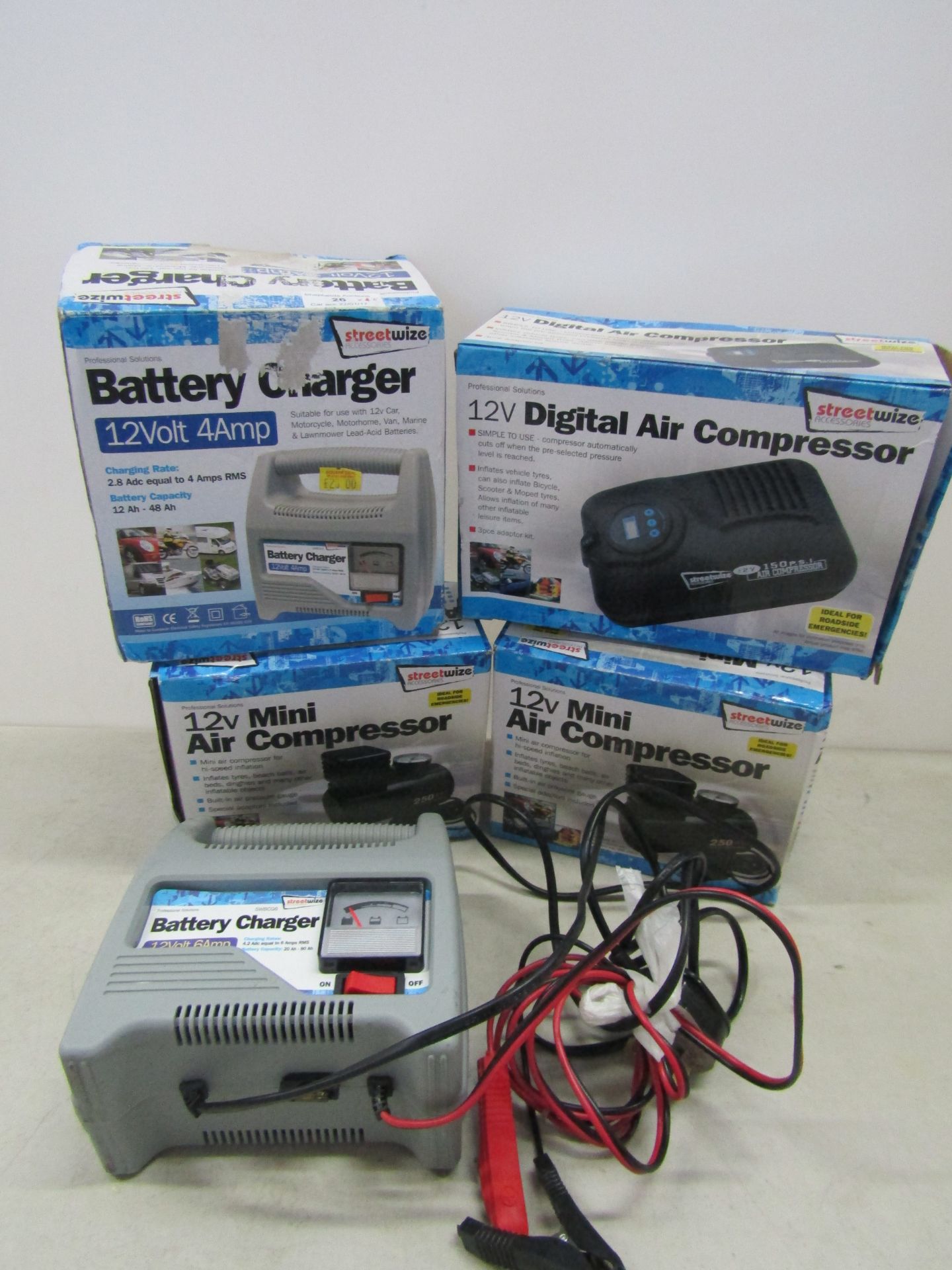 5x Items being; 2x 12v mini air compressors, 12v digital air compressor and 2x 12v battery chargers.